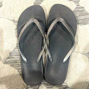 Sparkly silver flip flops